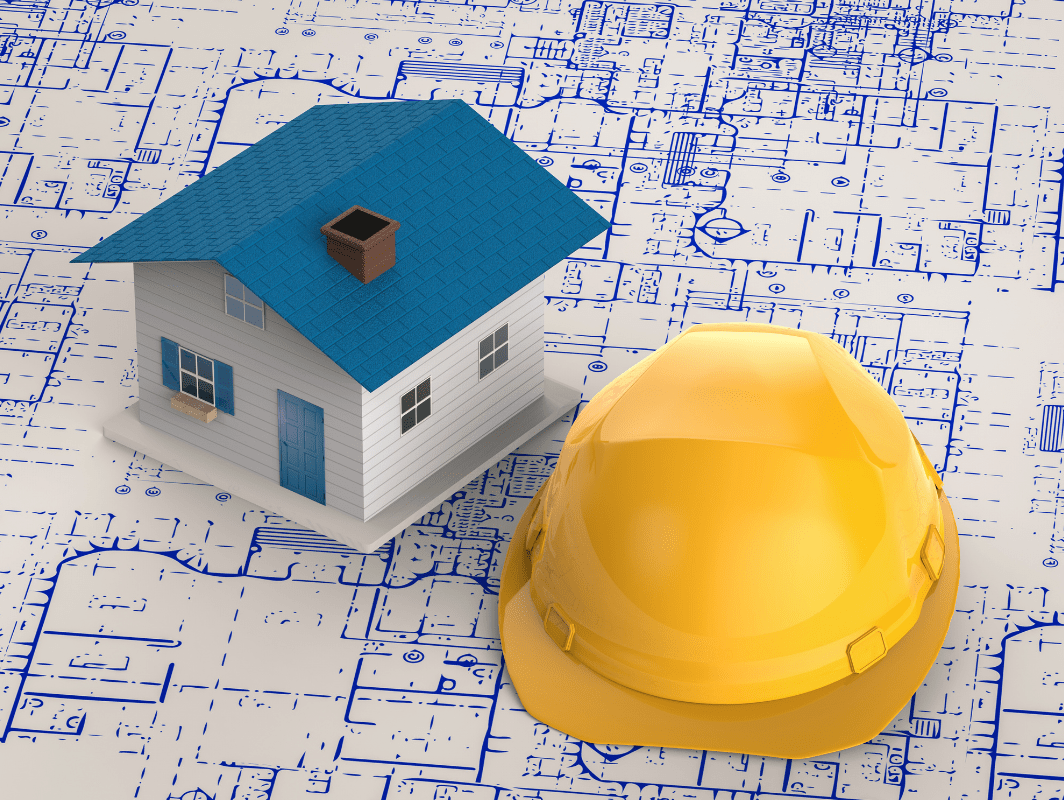 Image of home, hard hat and architect drawings