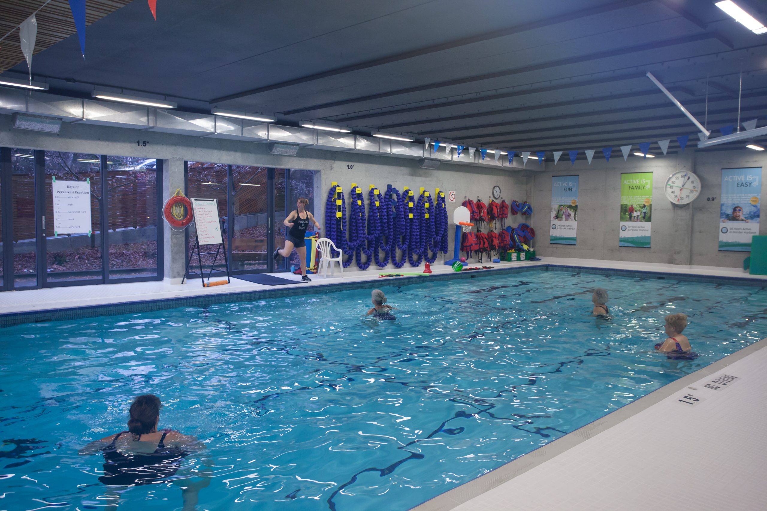 people taking part in an aquatic fitness class