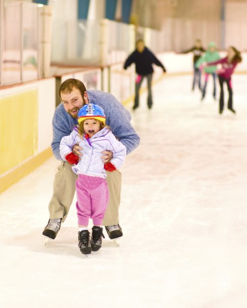 Father and Daughter at Ice Skating Rink