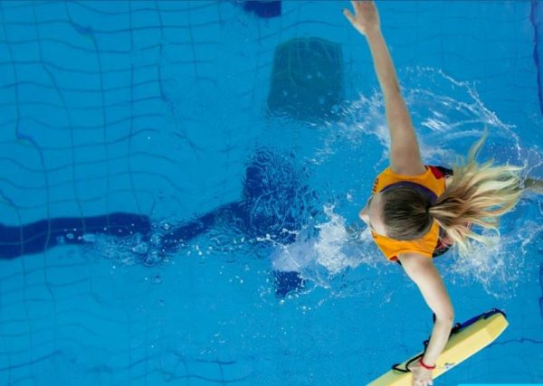 lifeguard jumping in the water